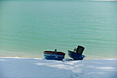 Two boats on the snowy shore, Walchensee, Upper Bavaria, Bavaria, Germany