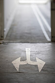 Arrows on ground of an underground garage