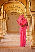 Beautiful Hindu woman at Amber Fort temple in Rajasthan Jaipur India