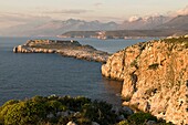 The Tigani peninsula, in the Deep Mani, with the Taygetos mountains in the background Southern Peloponnese, Greece The peninsular is also known as Grand Maina, and is associated with the site of Guillaume de Villehardouin's castle of that name