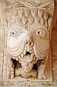 Carving of a tarasque, the legendary monster of Provence, devouring a man, Cloister of Montmajour abbey 12 cent, near Arles, Provence, France
