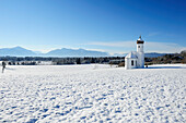 Snow covered church in front of range of Alps, Penzberg, Werdenfelser Land, Upper Bavaria, Bavaria, Germany, Europe