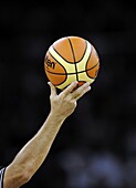 A referee holds a Molten ball during a friendly basketball tour ahead the Beijing 2008 Olympics at the Venetian Macao Resort-Hotel Casino in Macau, China