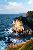 The Giants Head limestone cliff landmark at the White Rocks near Portrush, Northern Ireland Looking east to the Giants Causeway headlands
