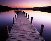 Sunset on Coniston Water from Waterhead jetty, Coniston, Cumbria, UK - England