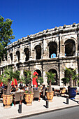 Place des Arenes - amphitheatre and restaurants, Nimes, Languedoc-Roussillon, France