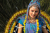 A peacock fan dancer at the Jaipur Elephant Festival, Jaipur, Rajasthan, India