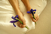 Female feet with lilies