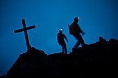 Mountaineers with headlamps at southeast ridge of Wildspitze, Oetztal Alps, Tyrol, Austria
