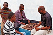 Local men playing Bao, Stonetown, Zanzibar City, Zanzibar, Tanzania, Africa