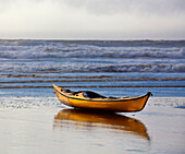 Kayak Resting on an Ocean Shore, Oregon, USA