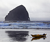 Kayak Resting on an Ocean Shore, Oregon, USA