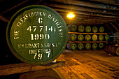 Warehouse full of oak barrels at the Glenfiddich Destillery, Dufftown, Aberdeenshire, Scotland