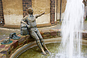 Fountain with sculpture of a pilgrim on the way to Santiago, Kaisersesch, Eifel, Rhineland-Palatinate, Germany, Europe