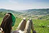 Woman resting on meadow, Kaiserstuhl, Baden-Wurttemberg, Germany