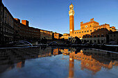 View of Palazzo Pubblico and fountain on square Piazza del Campo, Siena, Tuscany, Italy, Europe