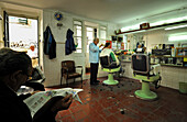 People at a hairdresser's shop, Lisbon, Portugal, Europe