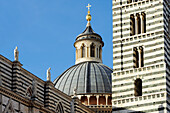 Facade of Siena cathedral with dome and spire, Siena, UNESCO World Heritage Site Siena, Tuscany, Italy
