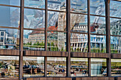 Reflection of Augustus Square and high rise building Krochhochhaus on glass facade of Neues Gewandhaus, Leipzig, Saxony, Germany, Europe