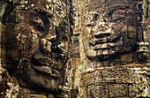 Cambodia, Angkor Thom, Bayon Massive stone faces watch your every move at Bayon, a well-known and richly decorated Khmer temple at Angkor in Cambodia