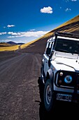 Argentina, Mendoza, Parque Provincial Payunia Tourist sight seeing 4 wheel drive jeep used to explore the reserve