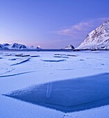 Ice on Haukland beach in winter, Vestvagøy, Lofoten islands, Norway