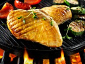 Chicken fillets cooking on a bbq
