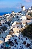 Oia Ia Santorini - Windmills and view of town, Greek Cyclades islands.
