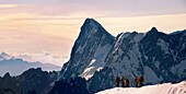 Climbers leaving Alguille du Midi for the Mont Blanc Massif, Chamonix Mont Blanc, France