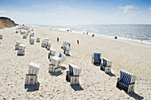 Roofed wicker beach chairs near Rotes Kliff, Kampen, Sylt, Schleswig-Holstein, Germany