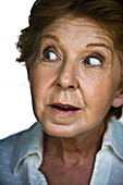 Senior woman displaying look of surprise