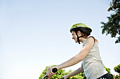 Teen girl riding bicycle