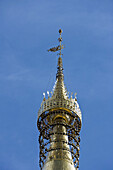 Yangon, Myanmar, dozens of little bells decorating top of Shwedagon Pagoda