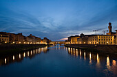 Florence, Italy, Arno river at night, Ponte Vecchio in the distance