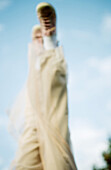 Person's legs in the air, sky in the background, defocused