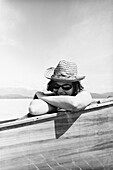 Smiling Woman in Sunglasses and Hat