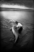 Woman Comforting Dying Dolphin