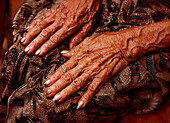 Elderly Hands on Lap, Close-Up, Bali, Indonesia
