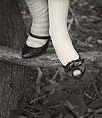 Woman Wearing Two Different Shoes and Stockings