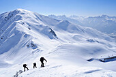 Group of backcountry skiers ascending Gaishoerndl, Villgraten mountains, Hohe Tauern mountain range, East Tyrol, Austria
