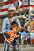 Street musician with guitar, Venice Beach,  Los Angeles, California, USA