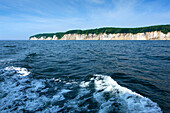 Ship excursion along the coast, chalk cliffs in the background, Ruegen island, Jasmund National Park, Baltic Sea, Mecklenburg-West Pomerania, Germany