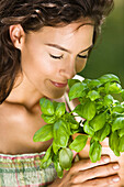 Young woman with aromatic herbs