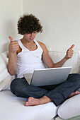 Teenage boy using his laptop
