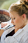 Portrait of a young woman eating chocolate