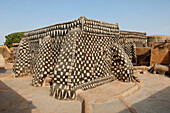Burkina Faso, village of Tangasomogo, fortified houses in the Tiebélé region on the border of Burkina Faso and Ghana, frescoes on the walls of their mud huts