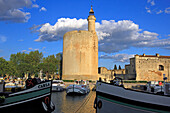 France, Languedoc, Gard, Aigues Mortes, ramparts and tour de Constance by canal