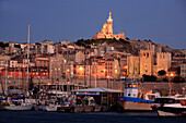 France, Provence, Marseille, Vieux Port harbor, Notre Dame de la Garde basilica