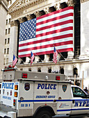 The United States. New York City. Policemen's car in front of the stock exchange of New York.