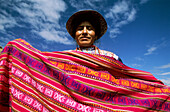 Peru, Colca canyon, market, woman holding fabrics
